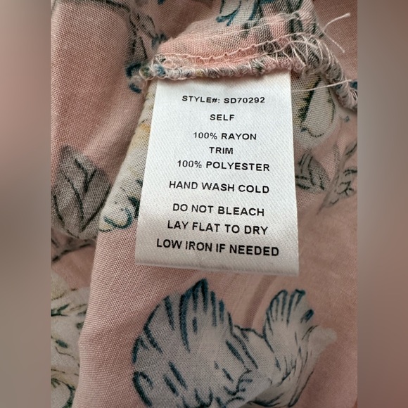 Hassles N Lace Floral tunic with lace trim flare sleeves. Neckline cross straps. - Picture 7 of 8